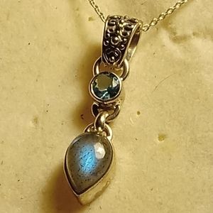 Moonstone and saphire pendant set in 925 sterling silver with gold chain